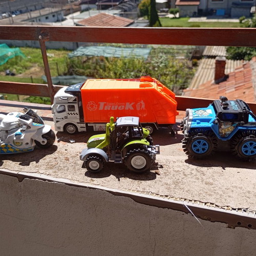 Lot of 4 used medium-sized children's toy vehicles