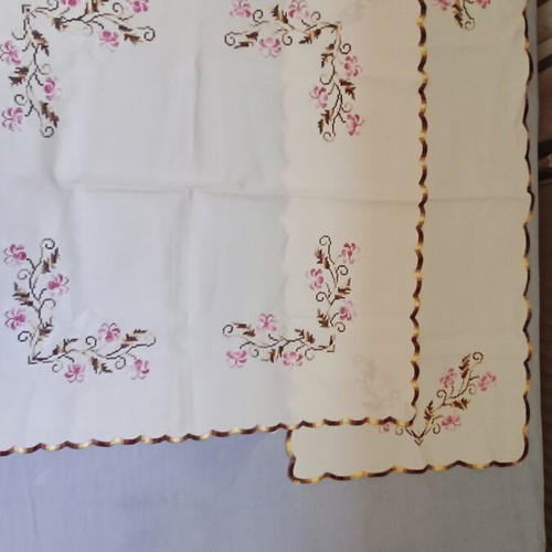 Vintage cream linen table linens set with pink floral cross-stitch embroidery and scalloped edge