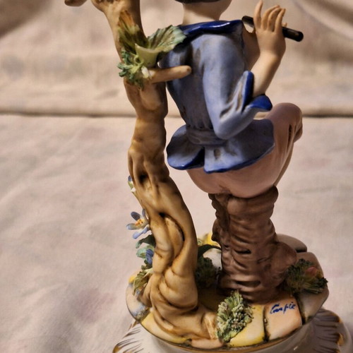 Capodimonte porcelain boy with flute like new with artist signature