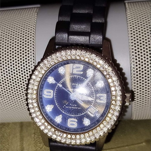 Newman watch used with blue dial and white crystals