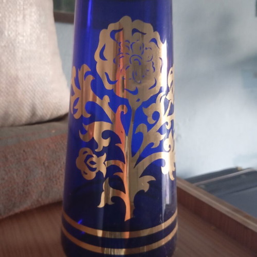 Vintage cobalt blue glass vase with gold designs used