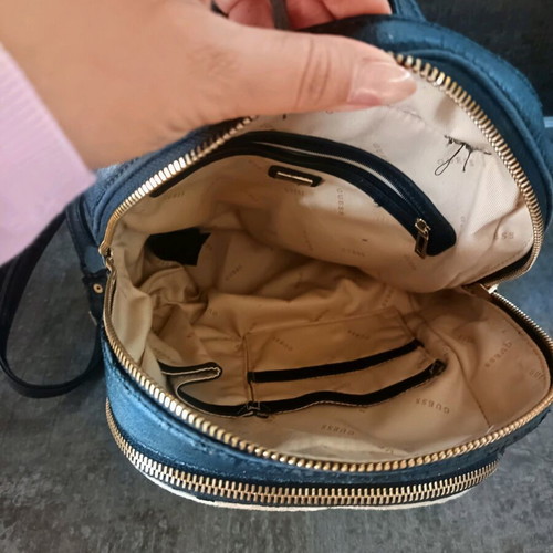 Guess backpack used with leather cracks