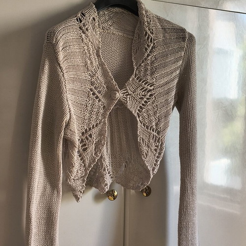 Beige knitted bolero cardigan with lace leaf pattern