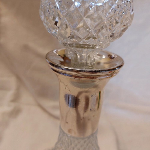 Crystal wine bottle used with silver-plated neck and stopper