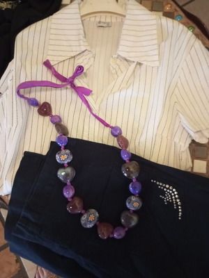 Clothing set used, pack No 1 with dress, shirts, pants, accessories