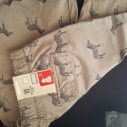 Package with 1 Zara vest 8-9 years, 1 new Orchestra shorts and 1 free t-shirt