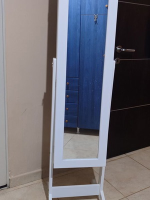 Full-length mirror with jewelry storage and shelves