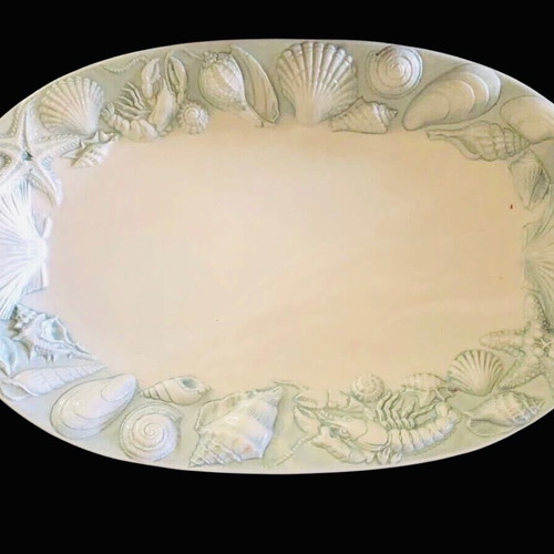 Oval ceramic platters used with summer-themed carving