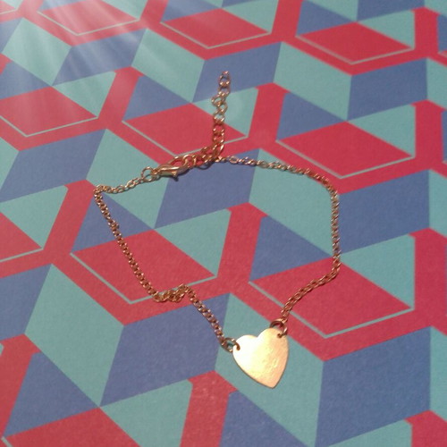 Gold-colored heart bracelet with chain