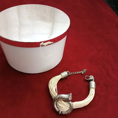 Bracelet with beige cords and metal elements like new