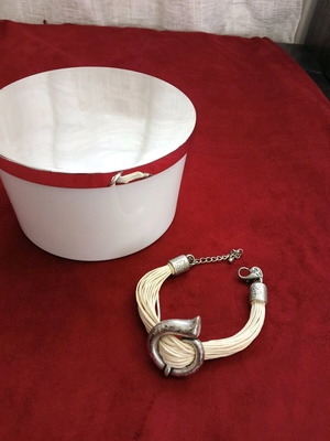 Bracelet with beige cords and metal elements like new
