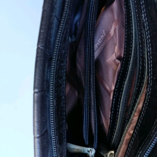 Black shoulder bag used with sturdy construction and multiple pockets