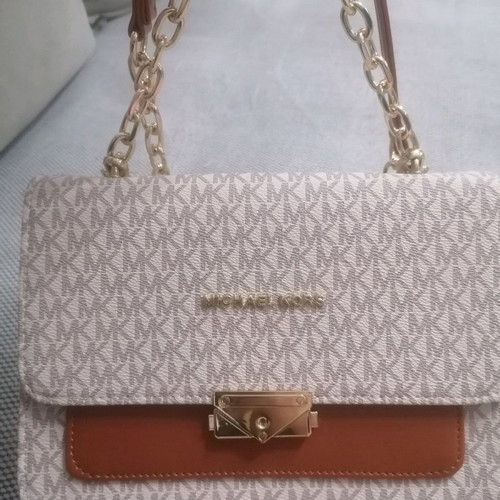 Shoulder bag used with strap for hand and shoulder