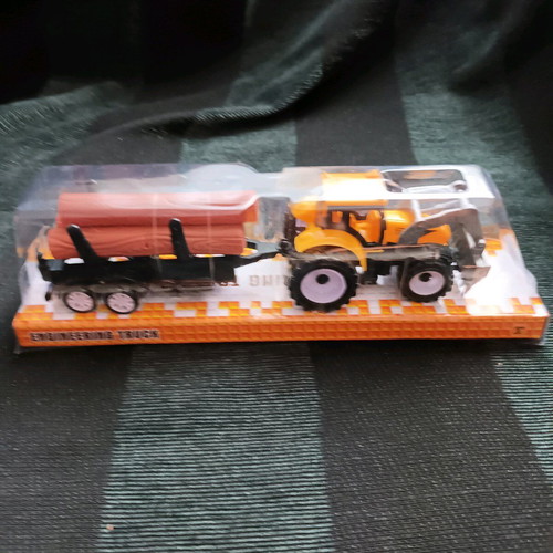 Tractor with trailer carrying logs new