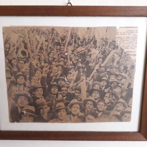 Newspaper scrap used from 1932 student rally in wooden frame