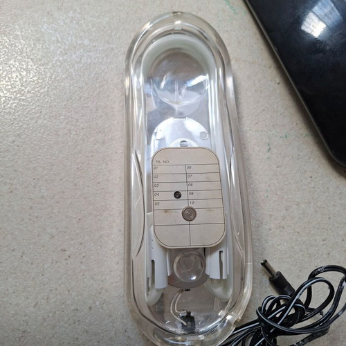 Vintage wired home phone with transparent neon design, new