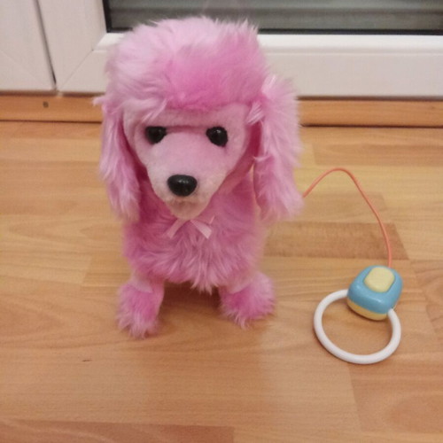 Toy dog with remote control like new that barks and moves