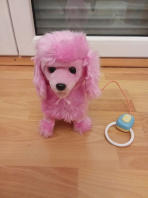 Toy dog with remote control like new that barks and moves