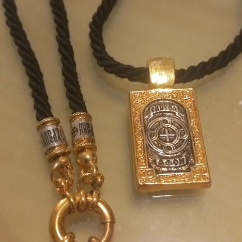 Religious pendant necklace like new, gold and silver