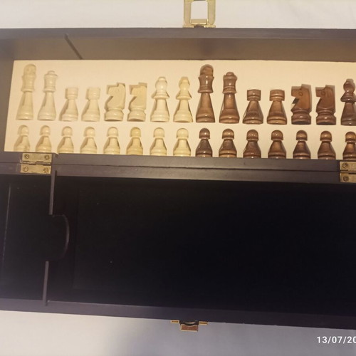 Wooden wine case used with travel chess set