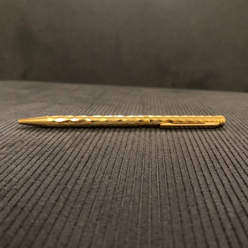Elegant pen like new in gold tone with blue ink
