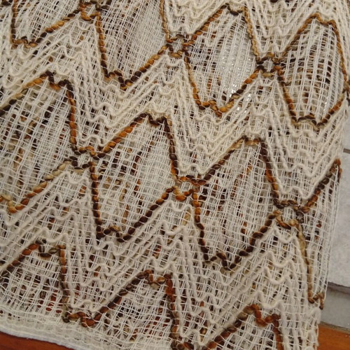 Pair of beige and brown curtains with ruffles, heavy knit
