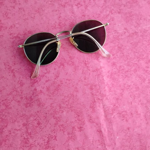 Round sunglasses with green mirrored lenses used, gold frame