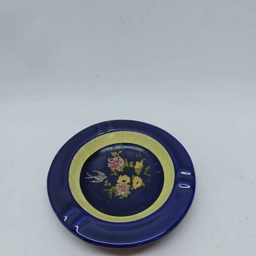 Porcelain ashtray used, blue shade with flowers and yellow details