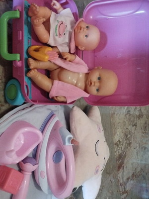 Baby dolls used with various accessories and toy iron