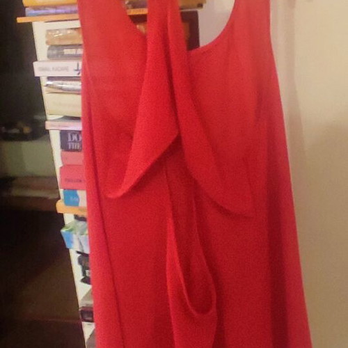 Red sleeveless flowing top used, size S, semi transparent material