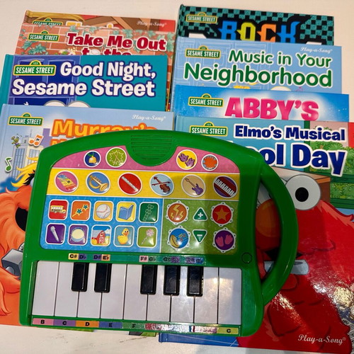 Sesame Street 8-Book Library with Portable Piano like new