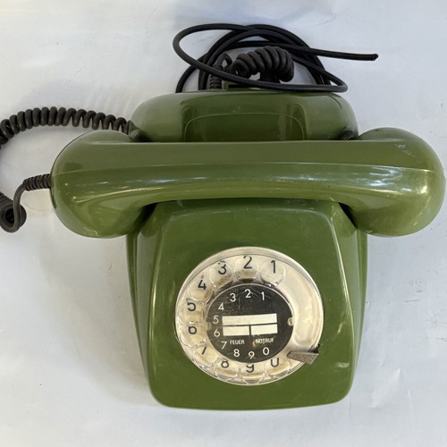 Vintage green telephone used, wired connection