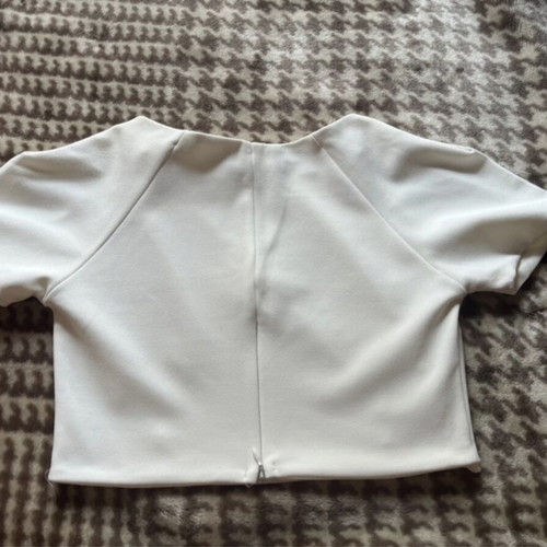 White top like new with cutouts and gold buttons size M