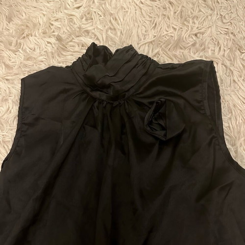 Black satin blouse with 3-D rose design like new
