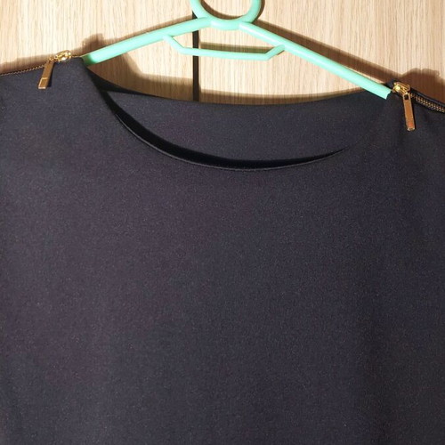 Mini black dress like new with zipper and gold details