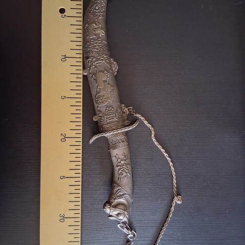 Decorative dagger with carved sheath, like new