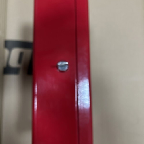 Red metal cash box with lock and key