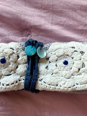 Blue pouch used for tobacco or jewelry