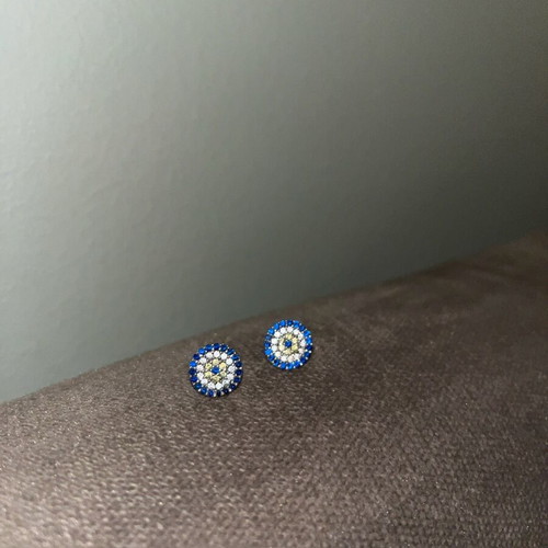 Silver stud earrings eye design used