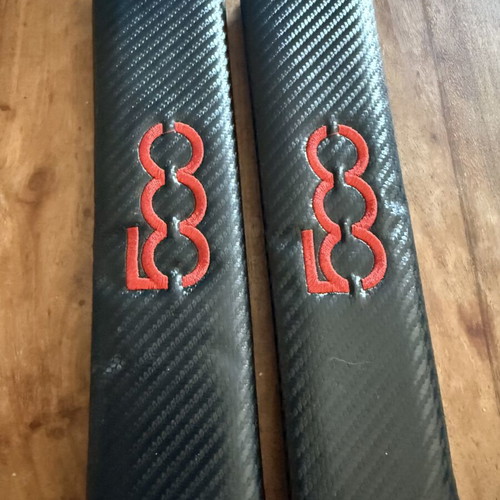 Fiat 500 carbon seat belt cushions