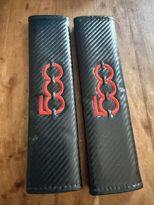 Fiat 500 carbon seat belt cushions