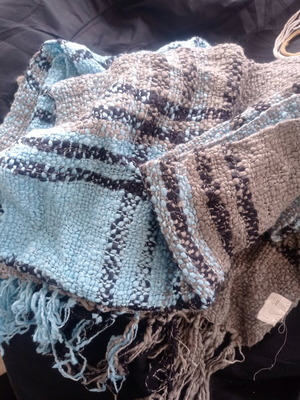Blue scarf used with fringes and thick yarn