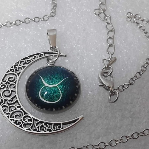 Pendant necklace with Taurus zodiac and crescent moon, like new