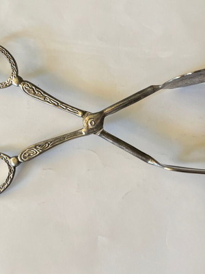 Vintage silver-plated serving tongs used