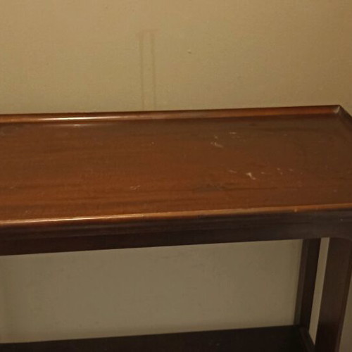 Wooden vintage coffee table like new with decorative wheels