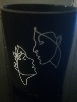 Goth type scented candle used, tabletop in glass
