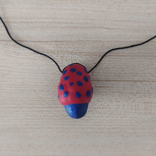 FIMO necklace used with red and blue mushroom design