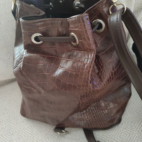 Brown bucket bag with shoulder and crossbody strap