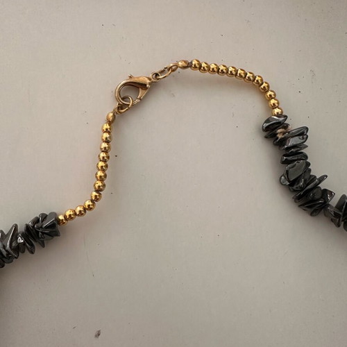 Metallic necklace like new with stones in gray and gold tones