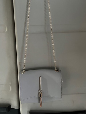 Crossbody bag light gray new with gold details
